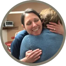 Dr. Lisa Marvil hugging a patient